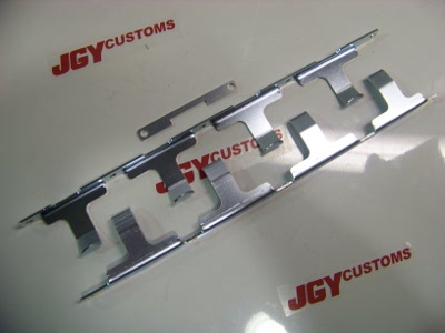 Tomei rocker arm stoppers